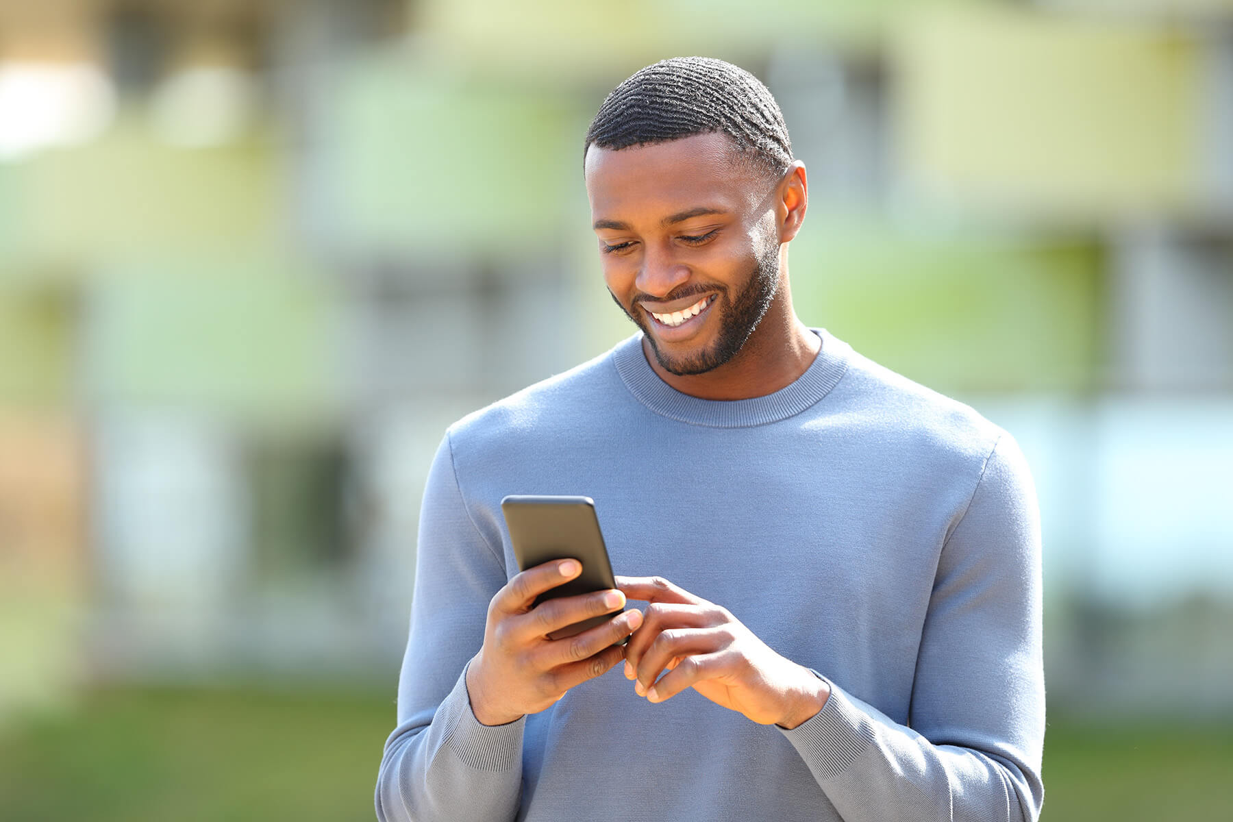 man using phone outside