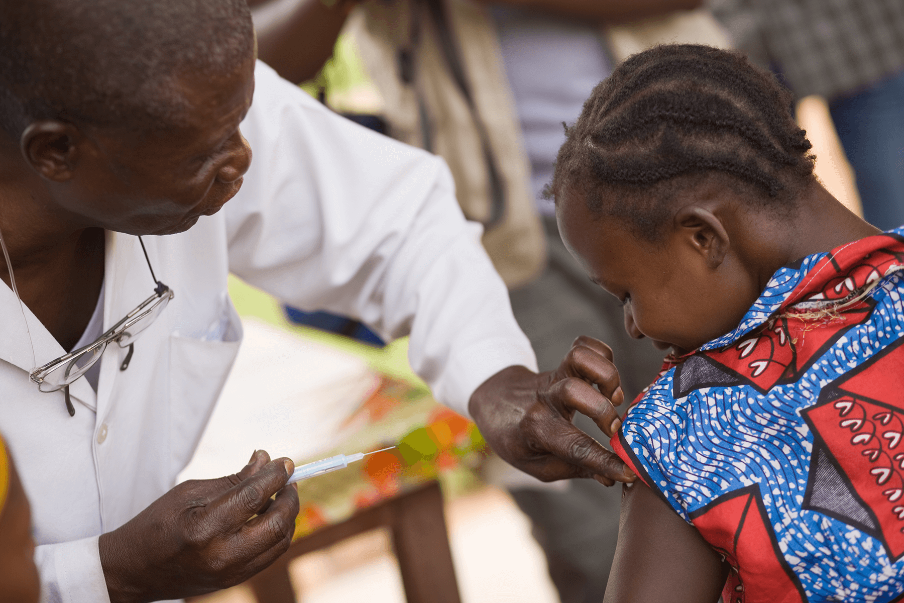 doctor giving a vaccine to a child