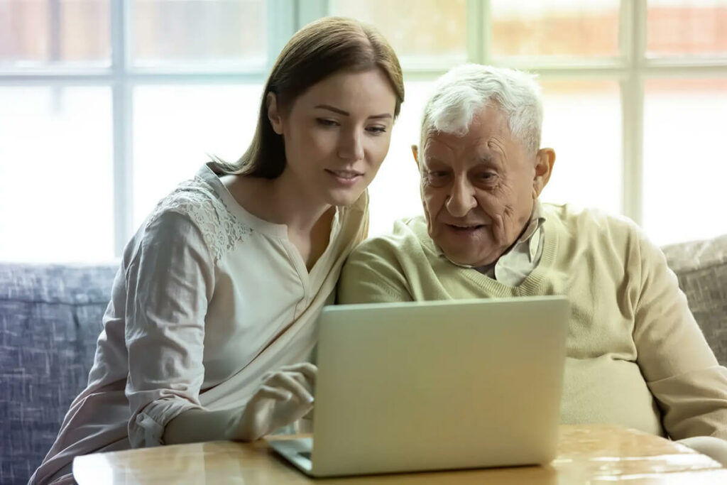 woman-with-father-looking-at-computer